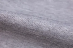 Close-up of high-quality soft grey heathered fleece fabric texture for sports hoodie