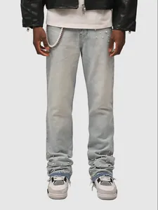 Men's light blue straight stacked jeans with white pearl embellishment and metal chain