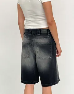 Back view of women's vintage washed black loose denim shorts with Motel label