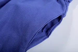 Close-up view of the side pocket detail on these casual blue knit wide-leg pants.