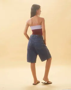 Back view of women's loose vintage denim shorts featuring a relaxed fit and back pockets