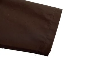 Close-up of brown fabric sleeve cuff with professional stitching for casual set