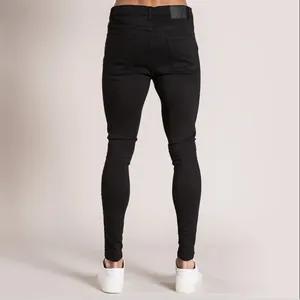 Vue arrière détaillée d'un jean skinny noir coupe ajustée pour homme en studio épuré