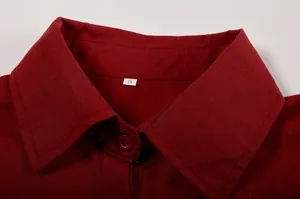 Detail view of a classic red lapel collar on a casual long-sleeved shirt for women