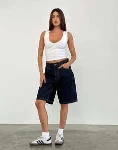 Women's vintage loose dark blue denim shorts paired with a white ribbed tank top