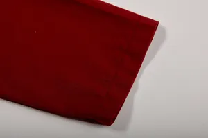 Detailed view of red shirt cuff featuring high-quality double-stitched hem for women