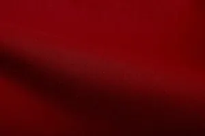 Macro texture view of high-quality dark red woven fabric for women's casual suit.