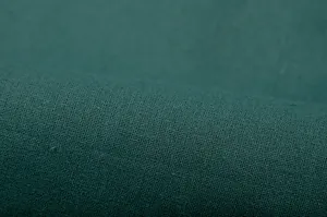 Detailed macro shot of high-quality dark teal fabric texture showing fine weave.