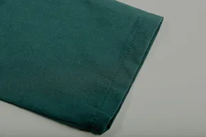 Close-up of the fine stitching and soft teal fabric texture of the casual women's set
