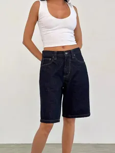 Women's vintage loose denim shorts in dark blue indigo, casual knee-length summer style.