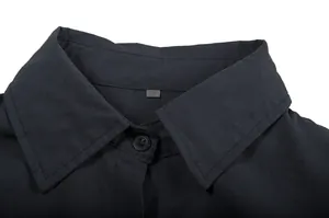 Detailed close-up of a classic navy blue shirt collar with a visible size S tag