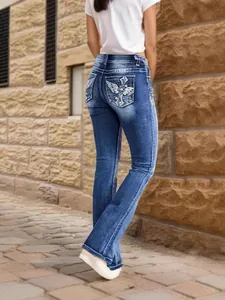 Stylish blue women's stretch flare jeans with embroidered cross wing back pockets