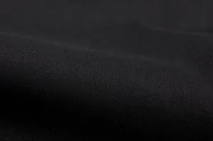 Detailed macro view of the premium black woven fabric texture for casual shirt and pants set