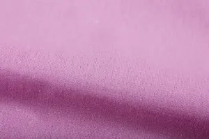 Close-up macro view of breathable soft pink linen fabric texture for casual apparel