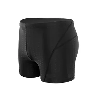 Detail view of men's black quick-dry swim trunks with subtle textured pattern
