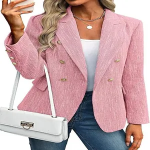 Close-up of pink tweed blazer featuring elegant gold buttons and structured lapels
