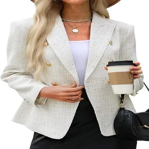 Detailed view of a chic white tweed blazer featuring elegant gold double-breasted buttons