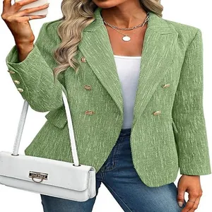 Detail showing texture and gold buttons of green women's street style blazer