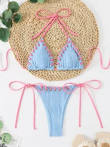 Light blue striped jacquard bikini set with pink halter neck lacing and eyelet detail