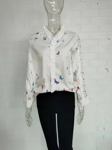Elegant white butterfly print shirt with ruffle collar and decorative lace sleeves.