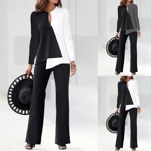 Modern color-block two-piece suit set featuring asymmetric tunic and wide-leg trousers