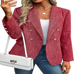Close-up detail of a red textured double-breasted women's blazer with gold buttons