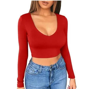 Close-up detail of a vibrant red long-sleeved V-neck crop top for women in casual style