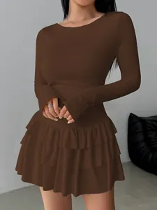 Detailed view of women's long-sleeved brown tiered ruffle mini dress with slim fit