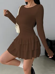 Detail view of brown slim fit long sleeve tiered ruffled mini dress for women
