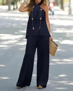 Elegante completo due pezzi da donna con top all'americana e pantaloni larghi blu scuro