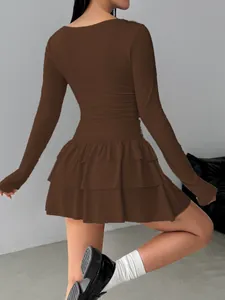 Back view of a slim-fit brown long-sleeved dress with tiered ruffle skirt detail