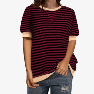 Detailed view of women's red and black striped t-shirt with beige crew neck and sleeve cuffs.