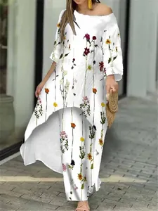 Elegantes Damen-Set mit Blumendruck, Tunika und weite Hose, präsentiert von einem Model