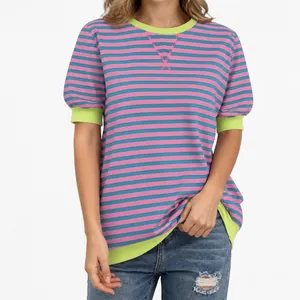 Detail of pink and blue striped t-shirt with contrasting lime green trim details