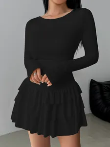 Close-up of elegant black long sleeve tiered ruffle mini dress for women