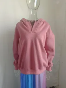 Detailed front view of a mauve oversized V-neck long sleeve hoodie on a mannequin
