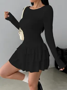 Elegant slim-fit black long-sleeved mini dress with a tiered ruffled skirt for women.