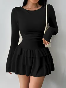 Elegant black long-sleeved slim-fit mini dress featuring a stylish tiered ruffled skirt
