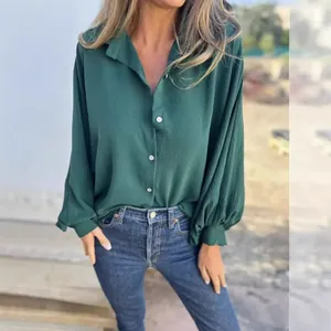 Elegant women's dark green long-sleeved button-down shirt with lapel and lantern sleeves.