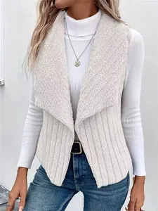 Detail view of a white fuzzy sleeveless vest jacket with a wide lapel for women