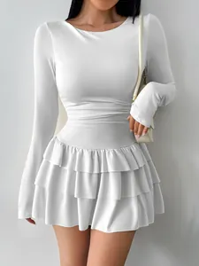 Elegant white long sleeve slim fit dress featuring a tiered ruffled skirt for women