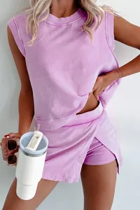 Close-up view of a lavender sleeveless top and matching wrap skort set on a model