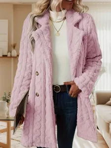 Detail of pink plush coat featuring cable knit texture and double-breasted design