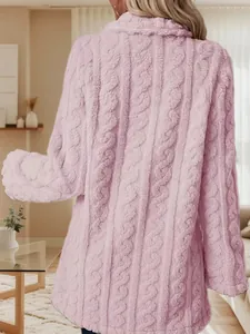 Detailed back view of a pink cable knit plush coat for women in a cozy home setting