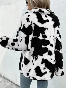 Back view detail of a loose cow-print plush jacket with soft faux fur texture