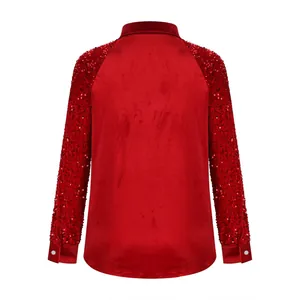 Detailed back view of women's red velvet shirt with sparkling sequin raglan sleeves