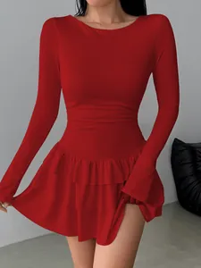 Detailed view of elegant red slim-fit long sleeve dress with tiered ruffle hemline design