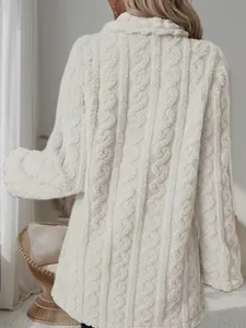 Close-up of women's white plush cable-knit coat showing fabric texture and back design