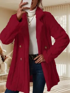 Close-up view of an elegant burgundy double-breasted plush coat featuring a cable knit texture