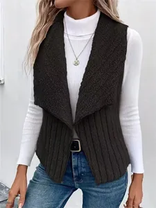 Detailed view of women's black sleeveless vest featuring a faux shearling collar